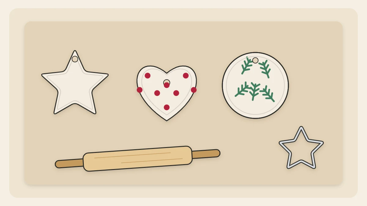 White air-dry clay ornaments in star, heart and round shapes, two painted with simple patterns, beside a small rolling pin and a cutter