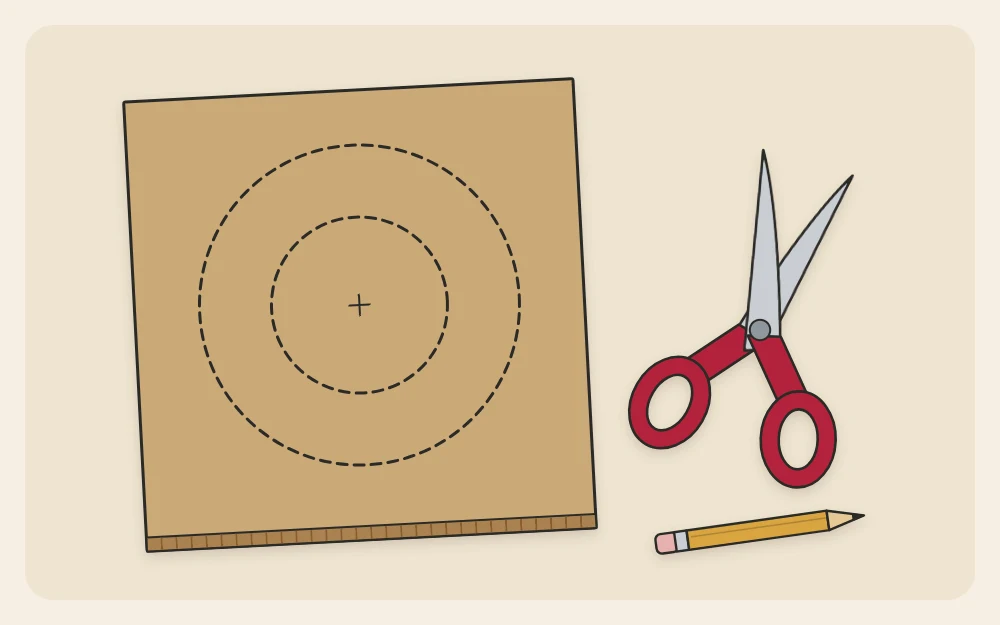 Two concentric circles drawn on a piece of cardboard with a pair of scissors beside it
