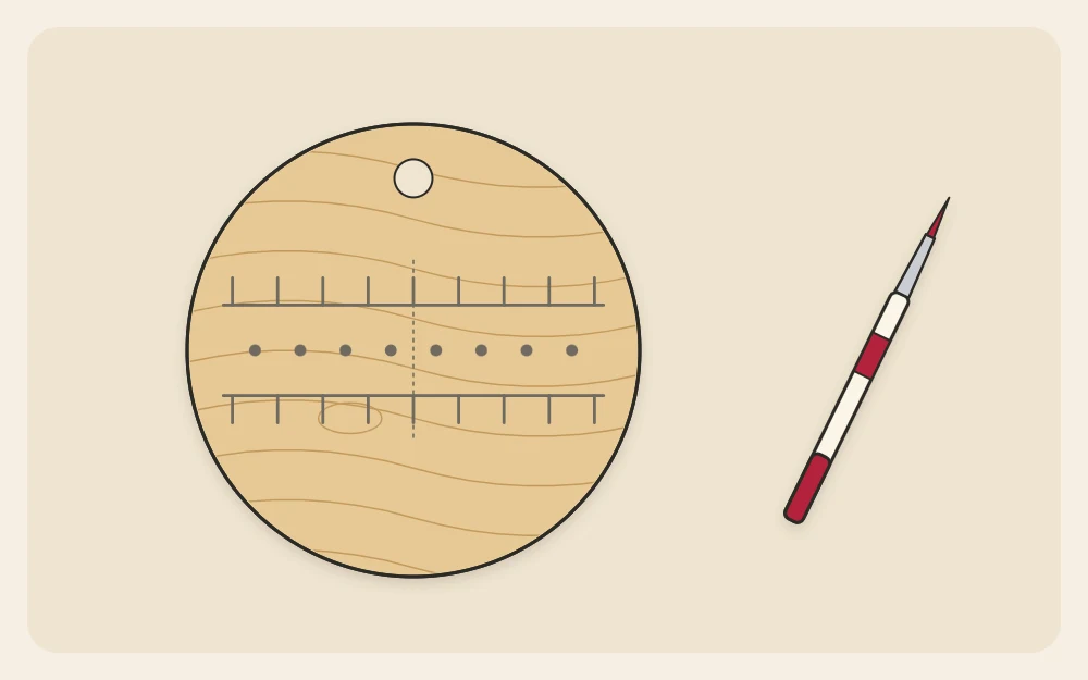 A wooden disc with light pencil guide lines and evenly spaced tick marks for planning letters, with a paint pen beside it
