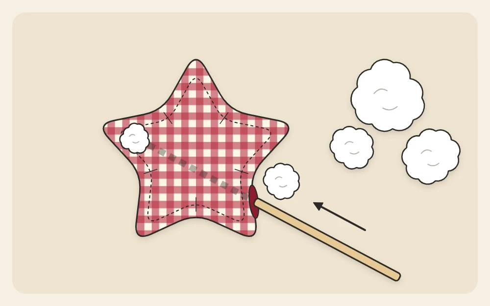 A fabric star turned right side out being stuffed through the gap with a blunt stick pushing filling into a point
