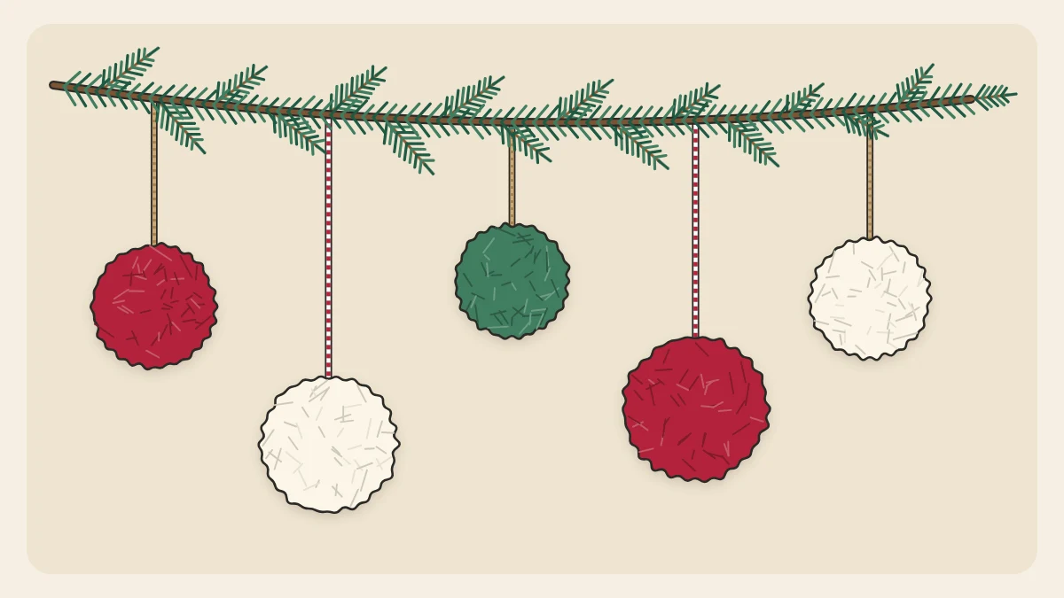 Five fluffy red, white and green pom-pom ornaments hanging at different heights from an evergreen branch